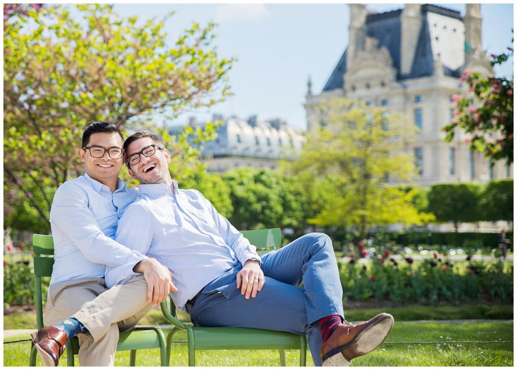 An engagement LGBT photo session in Paris, France at the Eiffel Tower, Alexander III Bridge and Louvre Pyramid